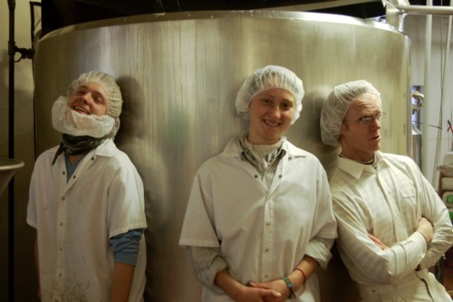 On a chilly March morning, Christian, Nadia and Tim warm up beside the 1000 gallon pasteurizing mix tank they've just filled with freshly made hemp 'milk'.